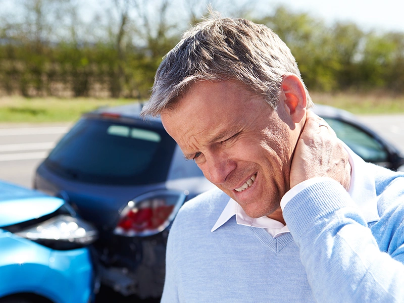 Chiropractor assessing patient alignment after an auto accident at The Shift in Oakland