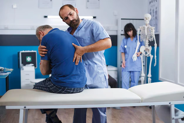 Chiropractor providing gentle care to an auto-accident patient at The Shift Chiropractic Oakland