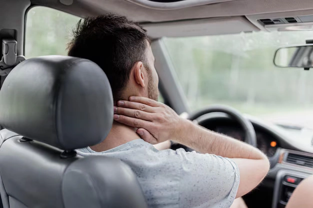 Driver experiencing neck pain — whiplash recovery at The Shift Chiropractic Oakland